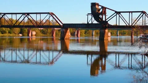 Pan of an old rail road bridge that still functions Stock Footage 143440537