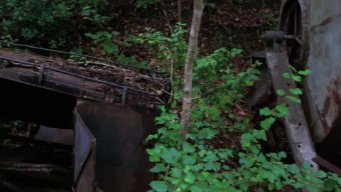 Pan of old rusted miner equipment Stock Footage 142849942