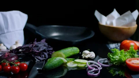 Pan with olive oil on the chef's table with cooking products Stock Footage 92553293