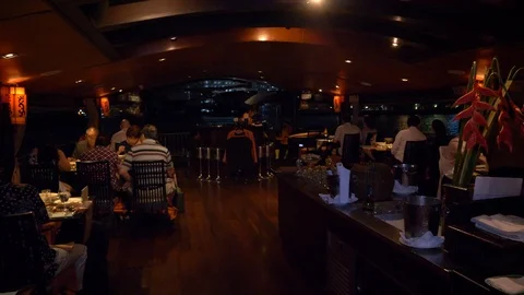 Pan onboard people dining on an upscale boat in bangkok Video stock 88651739