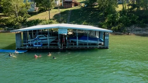 Pan out of boat dock with drone Video stock 102477633