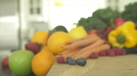 Pan of Out of Focus Produce Ends on a Green Broccoli Stock Footage 47476653