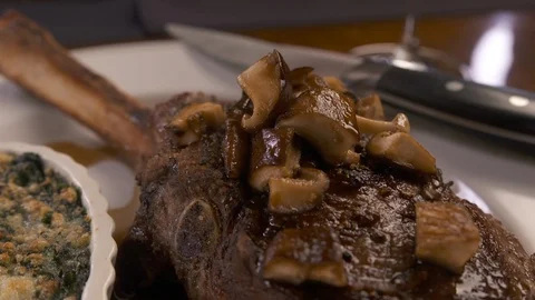Pan out of tomahawk steak  Stock Footage 112576004
