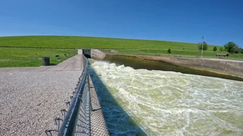 Pan of the outflow conduit pipe of the Saylorville Dam and Des Moines Stock Footage 284060853