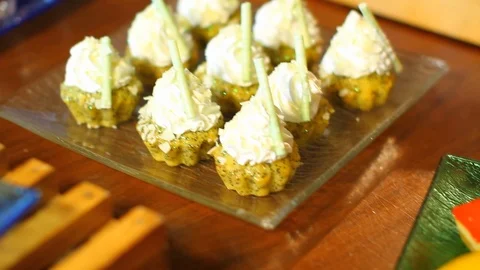 Pan over assorted mini desserts and shots at hotel buffet Stock Footage 123876190