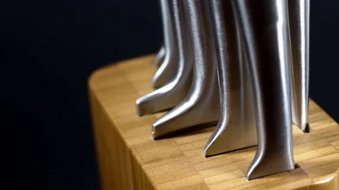 Pan Over A Bamboo Stand With Chef's Stainless Steel Knifes Video stock 75981727