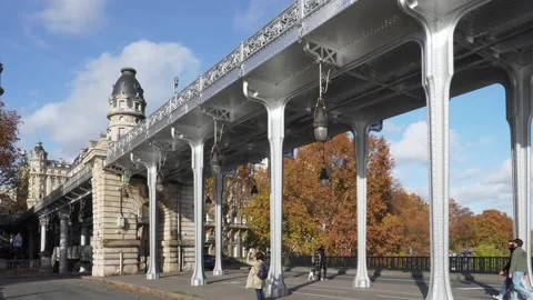 Pan over Bir Hakeim bridge with Eiffel tower in the background - Paris, France Stock Footage 143219129