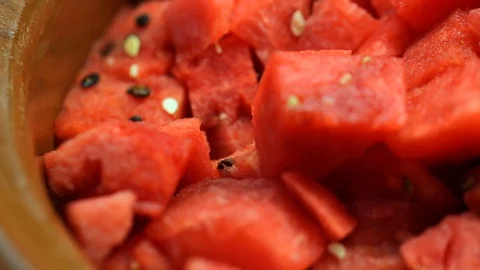 Pan over of bright watermelon chunks in fruit bowl Video stock 120406720