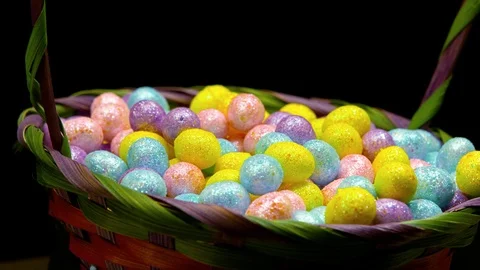 Pan over colorful easter eggs in a basket Video stock 87690566