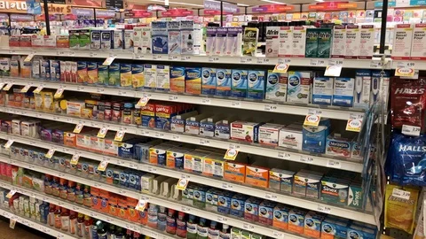 Pan of over the counter drugs at local Pharmacy Stock Footage