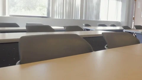 Pan Over Desks in Empty Classroom Stock Footage 80749292
