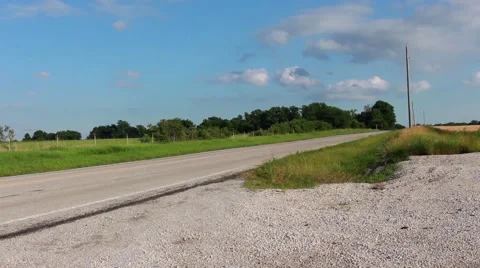 Pan over an empty and lonely Kansas road 스톡 동영상 39978205