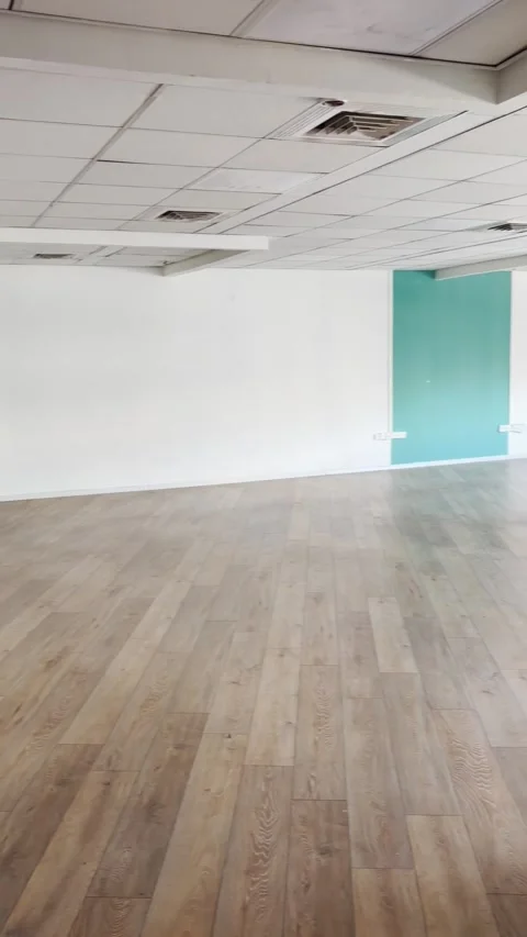 Pan over empty office floor with no furniture or people closed business or new Video stock 334012613