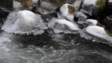 Pan over flowing river Stock Footage 86117063