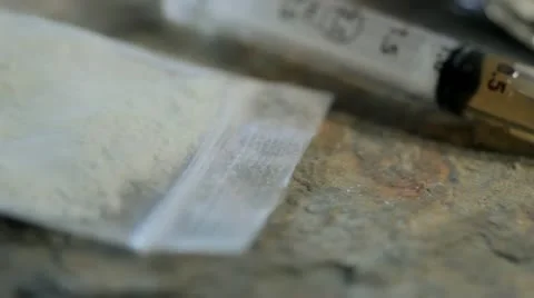 Pan over heroin user's gear Vídeo Stock 18902582