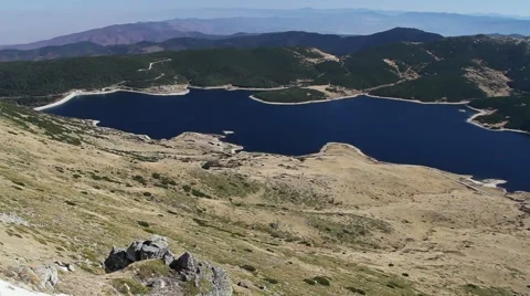 Pan over high mountain blue lake Stock Footage 40254685