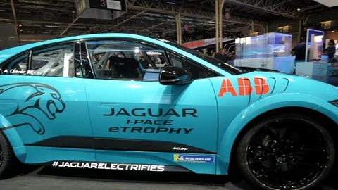 Pan over Jaguar i-Pace etrophy new electric hybrid SUV Stock Footage 113879800