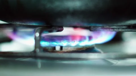 Pan over kitchen burner being turned on Stock Footage 234543420