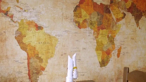 Pan over a large world map in a restaurant / Bistro Stock Footage