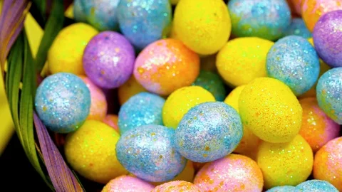 Pan over macro bright colored easter eggs Stock Footage 87690697