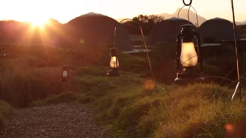 Pan over path with lanterns during sunset Stock Footage 71462691