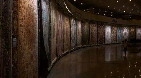 A pan over Persian handmade carpets with spotlight on the rugs. Stock Footage 66543060
