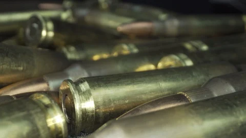 Pan over pile of bullets Stock Footage