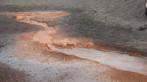 Pan over red hot volcanic spring Stock Footage 89588274