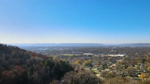 Pan over a small town located at the foot of mountains Stock Footage 148054408