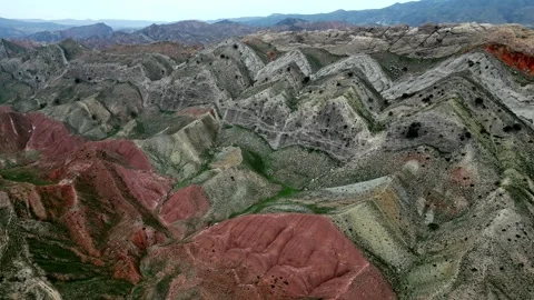 Pan Over Vibrant Folded Hills. High Above View Showcasing Richly Colored Stock-Footage 339085945
