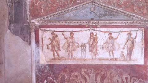Pan of painted lararium of five figures at pompeii Stock Footage 130985853