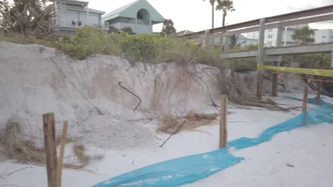 Pan of Pass a Grille Beach at St. Pete, Beach erosion Stock Footage 250709712