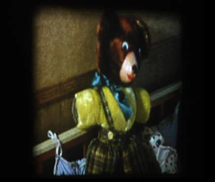 Pan past stuffed teddy bear to Infant in crib Stock Footage 33831725