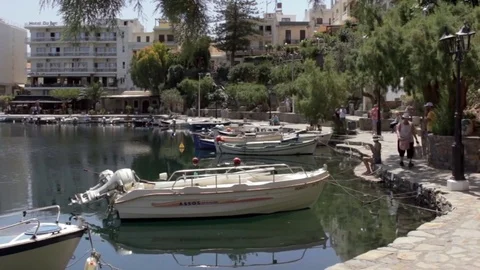 Pan from path over boats and pool Stock Footage 85303939