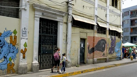 Pan-Pedestrian Auto traffic pass weathered art and graffiti Stock Footage 108599267