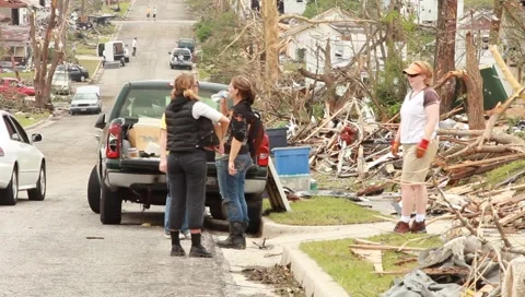 Pan of People Cleaning Up After Tornado Stock Footage 5437598