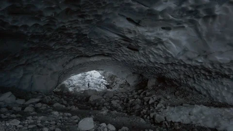 Pan of people inside ice cave in glacier in German Alps Stock Footage 121753555