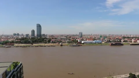 Pan of Phnom Penh balcony high angle and luxury building across Tonle Sap riv Stock Footage 48269149