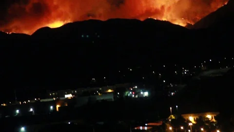 Pan from railroad to fire in the hills Stock Footage 109203861