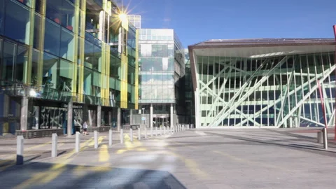 Pan of the  redeveloped Grand Canal Dock with Grand Canal Theatre in Dublin Stock Footage 203949686