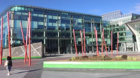 Pan of redeveloped 'Grand Canal Dock' with 'Grand Canal Theatre' in Dublin Stock Footage 203955015