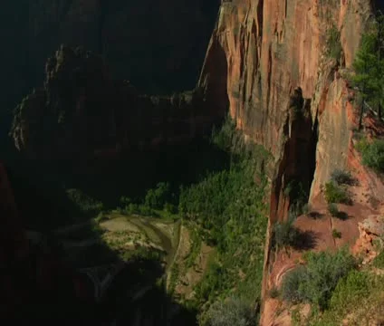 Pan up of redrock cliffs and mountains Stock Footage 21681416