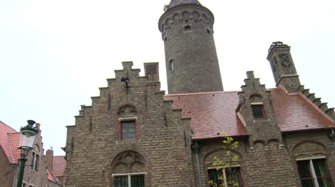 Pan from regular brick building to finer monumental building Stock Footage 55373353