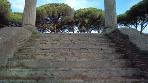 Pan up on the remaining columns of the Temple of Ceres in Ostia Antica, Rome Stock Footage 160739144