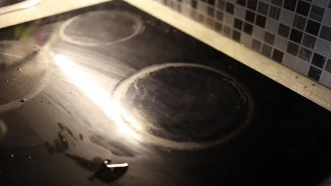 Pan removed from stove empty burner after cooking Stock Footage 329449484