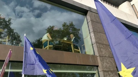 PAN FROM RESTAURANT TO MASSIVE CROWD AT BREXIT RALLY UK 4K Stock Footage 118278154