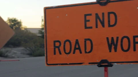 Pan to Reveal "End Road Work" Safety Sign Stock Footage 64364557