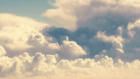 Pan Up Reveal of Huge Dark Cloud Stack Casting Deep Shadows on Cumulus Clouds Stock Footage 345089265