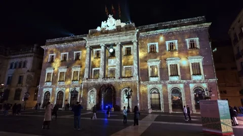 Pan up revealing Christmas projection mapping on Palau de la Generalitat in Video stock 340347382