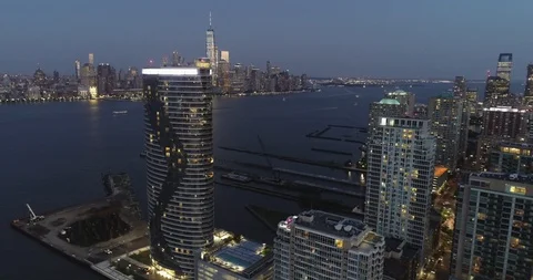 Pan Right Aerial of Jersey City, New Jersey at Night Stock Footage